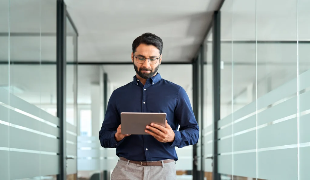 A man holding a tablet is testing the waste management platform